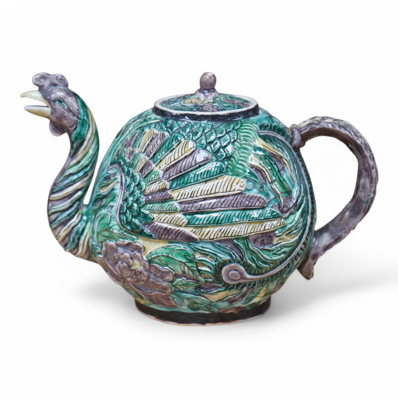 A Chinese susancai teapot in the form of a phoenix, Qianlong mark but 19th century, 15cm high. Condition - fair, repair to handle.